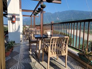 Outdoor terrace seating at The Sitting Elephant in Rishikesh