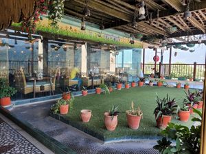 Outdoor rooftop terrace at The Sitting Elephant in Rishikesh