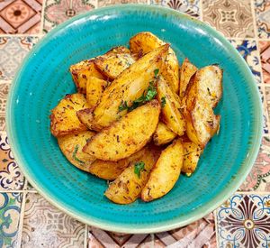 Cajun spiced potatoes  at Trattoria by Cinque - Five in Dubai