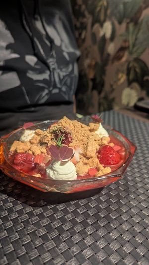 Hard to describe 😄 Sort of pudding with strawberries and crushed biscuits at ÖUR in Stockholm