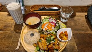 Plate with the Japanese style "meat." With extra salad and avocado 🥑 topping, plus a tasty big smoothy on the side. at Paprika Shokudo Vegan in Osaka