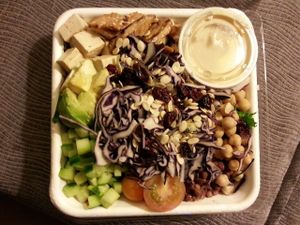 Monster protein salad (to go). Grilled tempeh, marinated tofu cubes, avocado, chick peas, dried cranberries, marinated adzuki beans, red cabbage, cucumber, grape tomatoes & hulled watermelon seeds on lettuce. at Fresh on Eglinton in Toronto