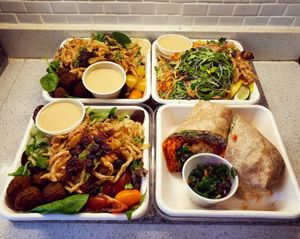 Takeout from Fresh...Ultimate falafel salads, Phytosalad, and Buffalo chick'n wrap. at Fresh on Eglinton in Toronto