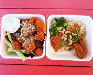 Buffalo cauliflower wings with vegan ranch dressing, and a small tikka masala bowl (coconut, vegetable and chick pea curry, steamed broccoli, chick’n tenders, roasted cashews, and cilantro served over rice). Photo taken June 2018. at Fresh on Eglinton in Toronto