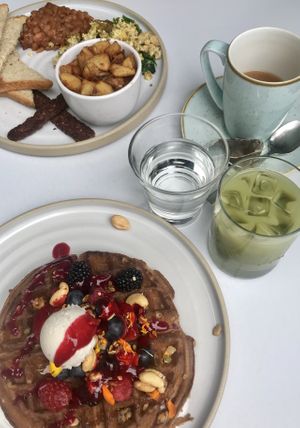 Berry waffle and full breakfast. Iced matcha latte and English breakfast tea at Fresh on Eglinton in Toronto