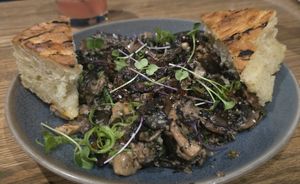 Vegan Wild Mushrooms & GUF Greens  (with extra mushrooms instead of egg) served with vegan focaccia bread. We would definitely order this again. at Gather in Omaha