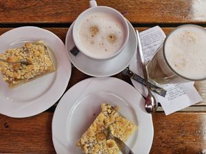Apple crumble cake, Cappuccino & Latte Macchiato with oat milk at Café Südpark in Dusseldorf