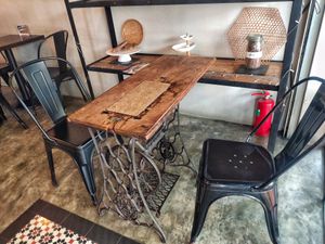 Dining table made from old sewing machine at Afterglow by ANGLOW in Central Singapore