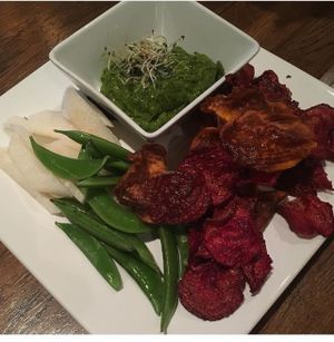 Curried spinach dip with jicama, beet chips, and peas at Nosh Eatery and Tap in Saskatoon