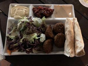 Yummy! Falafel with lettuce and bread. Three dips: Hummus, peanut and aubergine ! at Vegi in Tubingen