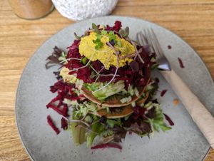 Savory pancake stack on a different visit at New Earth Cafe in Coolum Beach