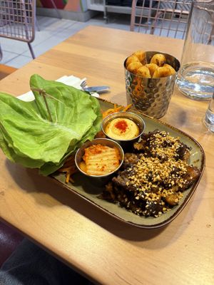 Korean BBQ Lettuce Wrap and Yucca fries. Really good sauces!  at Lulu Green in Boston