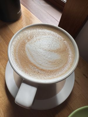 Latte with rose pistachio latte with oatmilk   at UP Coffee Roasters  in Minneapolis