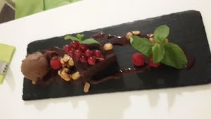 Chocolate Brownie with peanuts and icecream at The Green Garden in Salzburg