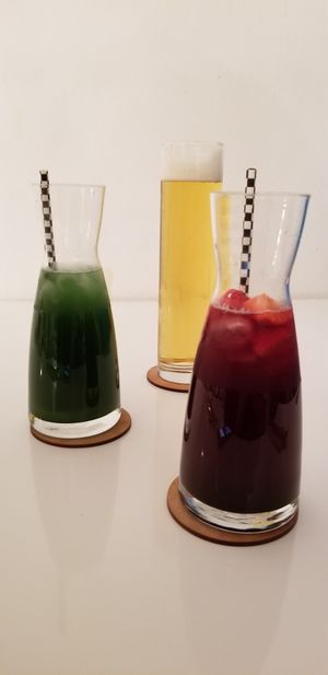 Matcha ginger iced tea, red berry iced tea, and a local beer at The Green Garden in Salzburg