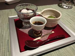 Zenzai, a traditional Japanese dessert: sweet red beans with mochi. To the right, warabi mochi with kuromitsu syrup. at The Dining - Shiba Park Hotel in Tokyo