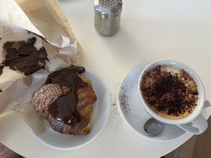 Cornetto con crema al cioccolato e cappuccino di soia con cacao amaro  at La Fabbrica del Cornetto in Gallipoli