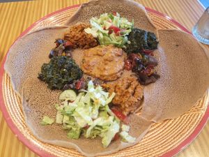 Bibiani - Injeera with all the vegan toppings at Nas in Alkmaar