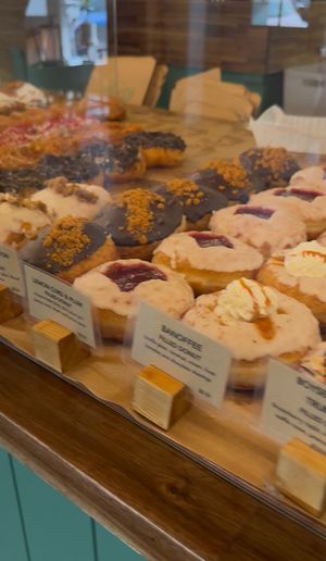 Soooo many sweets, including gluten free donuts at the top! Sorry for the quality, photo taken from a video  at Belen Plant Bakery - Petone in Petone