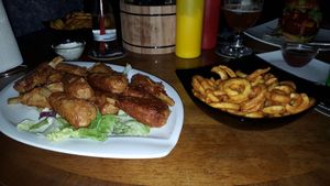 Vegan chicken wings and curly fries. at Lily Burger in Berlin