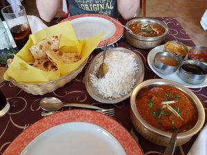 Chana massala (top) and vegetable kofta (bottom) with some naan, rice, and chutneys at Sabor da India in Funchal