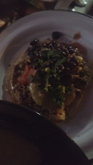 Blurry dark pic of taco with all the toppings at Por Siempre Vegana - Food Stall in Mexico City