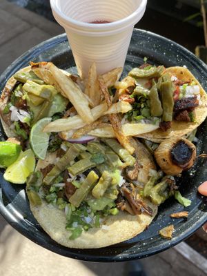 Delicious tacos and salsas! Don’t miss out on that little roasted onion! It’s a vibe in itself.  at Por Siempre Vegana - Food Stall in Mexico City