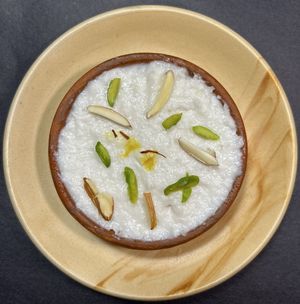 Phirni: a generation passed Indian dessert, slow cooked grounded rice in plantmilk, spices n nuts. Contain: coconutmilk. Glutenfree. ₹80 per portion.  at Vegan Daily  in Kolkata
