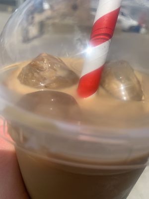 Iced oat latte with caramel syrup   at Milk & Honey in Seahouses