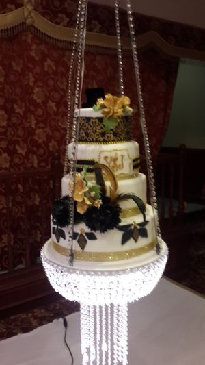 4 tier very unique fondant wedding
 cake on the swing
 at Rose Valley Cakes in Queens