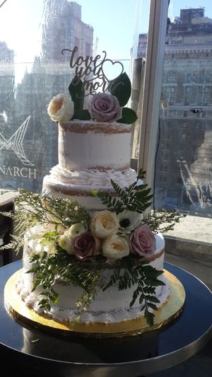 3 tier naked cake with fresh flowers at Rose Valley Cakes in Queens