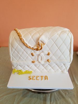 Hand purse style vegan cake at Rose Valley Cakes in Queens