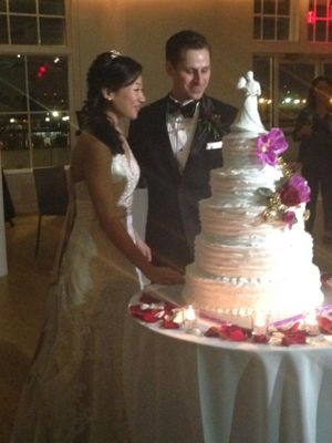 Chocolate and coconut five-tiered wedding cake at Rose Valley Cakes in Queens