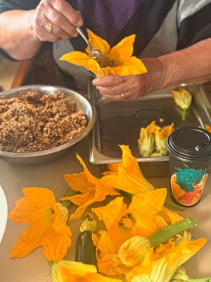 85 year old grandma stuffing zucchinis flowers  at Athos Cafe Deli in Strathmore