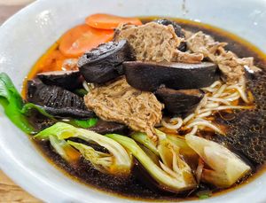 Beef noodles, slightly oily and salty, still ok can eat at Vegetarian 素 in Kuching