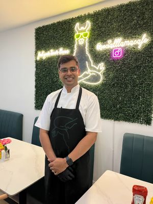 Chef Ishan working his magic at Social Llama.  Stop by for the food and stay to chat with the chef! at Social Llama Cafe in Toronto