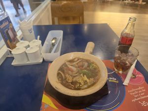 Vegan noodle plant based meat clay pot at SEE FAH Restaurant in Bangkok