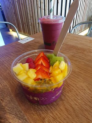Pink Pitaya Bowl: Granola, strawberry, mango, pineapple, kiwi, raspberry, passionfruit, agave at The Plant Boost in Wilmslow