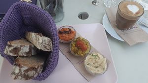 Breakfast with cappucino at Deli Bluem in Vienna