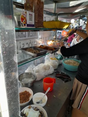 The big cart acts as a kitchen area at Quan Chay A Di Da Phat in Ho Chi Minh City