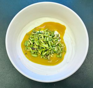 Coconut yogurt with mango puree  at Brasserie Boulud - Sofitel Dubai The Obelisk in Dubai