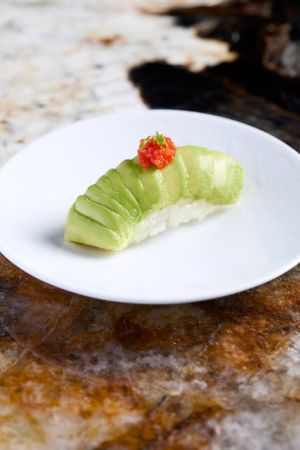 Avocado nigiri: ripe avocado, homemade teriyaki sauce, toasted macadamia nuts at Linfa da Visionnaire - Piazza Cavour in Milan