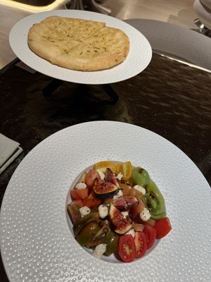 Tomatoes with fig and mozzarella and focacciaa  at Linfa da Visionnaire - Piazza Cavour in Milan