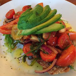 avocado and tomatoes on rye bread  at Foodstory Cafe in Aberdeen