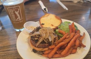 Vegan Burger with carmelized onions,  mushrooms, avocado, horsersdish, Sweet Potato Fries and apricot ale at The Office Bar and Grill in Cheyenne