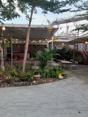 Inside is a large open aired restaurant at Xóm • Chay & cà phê in Ho Chi Minh City