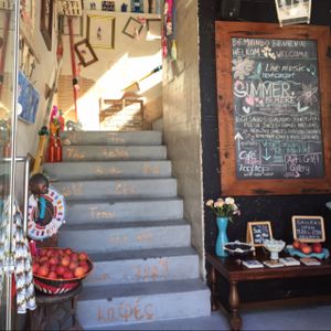 Entry at House of Wonders Unipessoal.  the chalk board identifies they have a restaurant.  at House of Wonders in Cascais