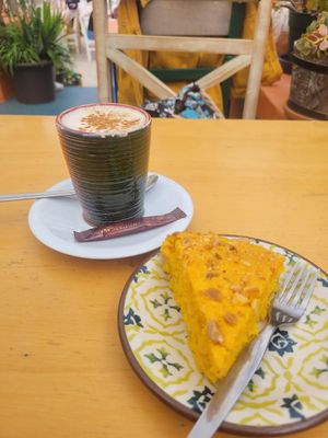 Carrot and orange cake 5€ plus cappuccino 2,5€ at House of Wonders in Cascais