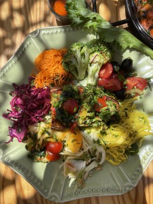 Vegetables on sweet potato, with salad surrounding. Ask for vegan option - without the cream drizzle on top.  at House of Wonders in Cascais