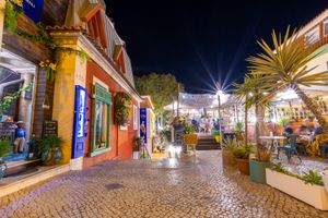As night falls, our restaurant's entrance transforms into mesmerizing gateway, illuminated by gentle glow that beckons you into an refined ambiance of culinary delights. at House of Wonders in Cascais
